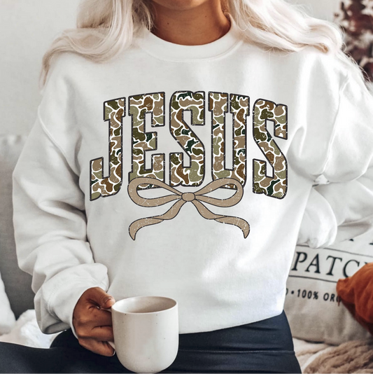 Woman wearing white Jesus sweatshirt with bow design – Christian faith based crewneck
Cozy white crewneck sweater with bold Jesus varsity lettering and bow accent
Religious sweatshirt for church, casual wear, and inspirational gifts