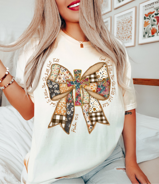 Woman wearing faith bow t-shirt with rustic fall patchwork design
Cream Christian tee with Psalm 46:5 scripture verse
Rustic patchwork bow graphic shirt for fall fashion
Cute faith-based autumn graphic tee for women