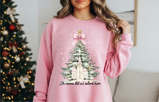 Pink Christmas sweatshirt with tree and chapel that says Oh come let us adore Him
Faith-based holiday sweatshirt in pink
Cozy unisex Christmas crewneck with chapel design