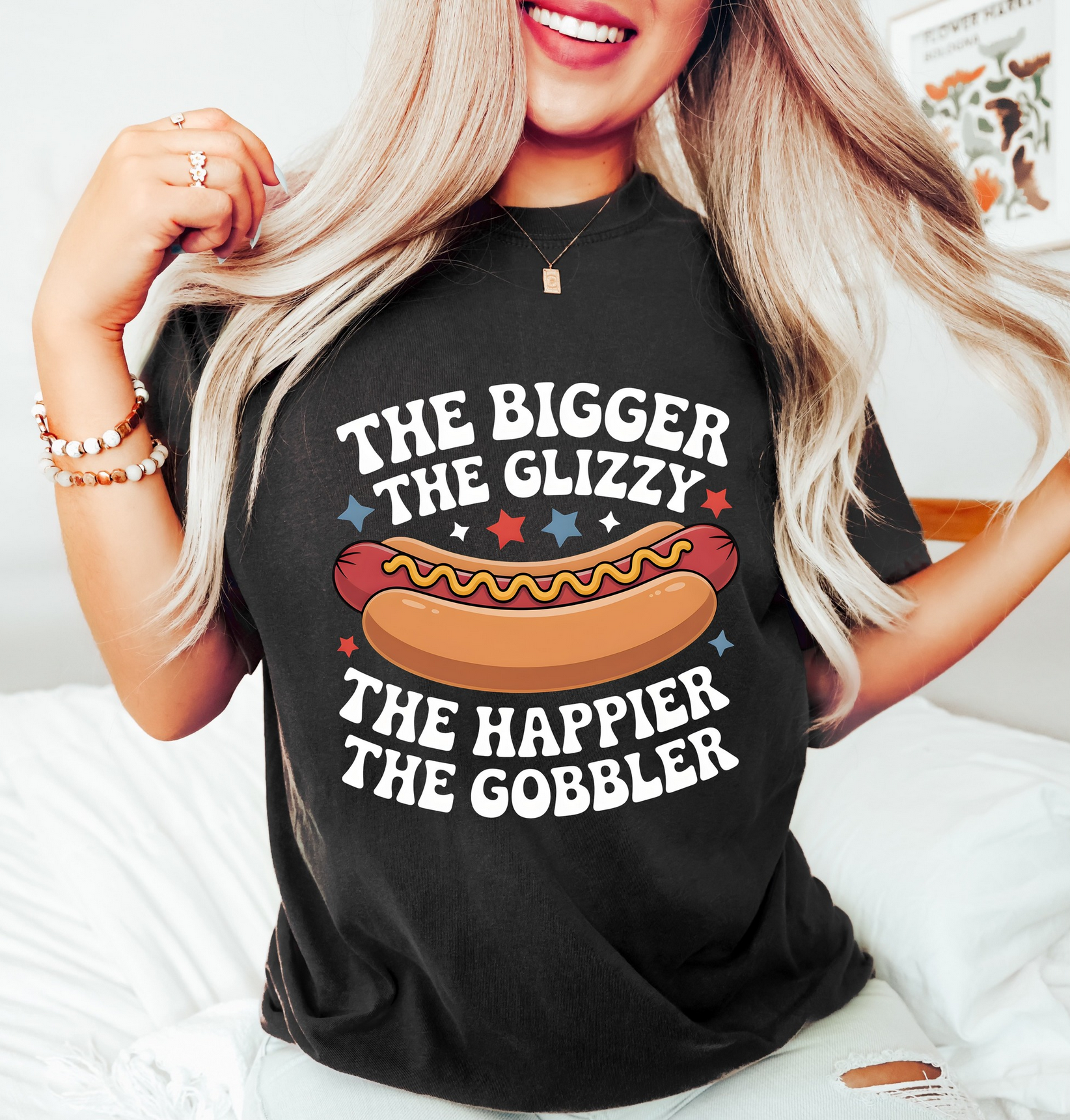 Black graphic t-shirt featuring funny hot dog design with The Bigger The Glizzy The Happier The Gobbler phrase for BBQ party outfits