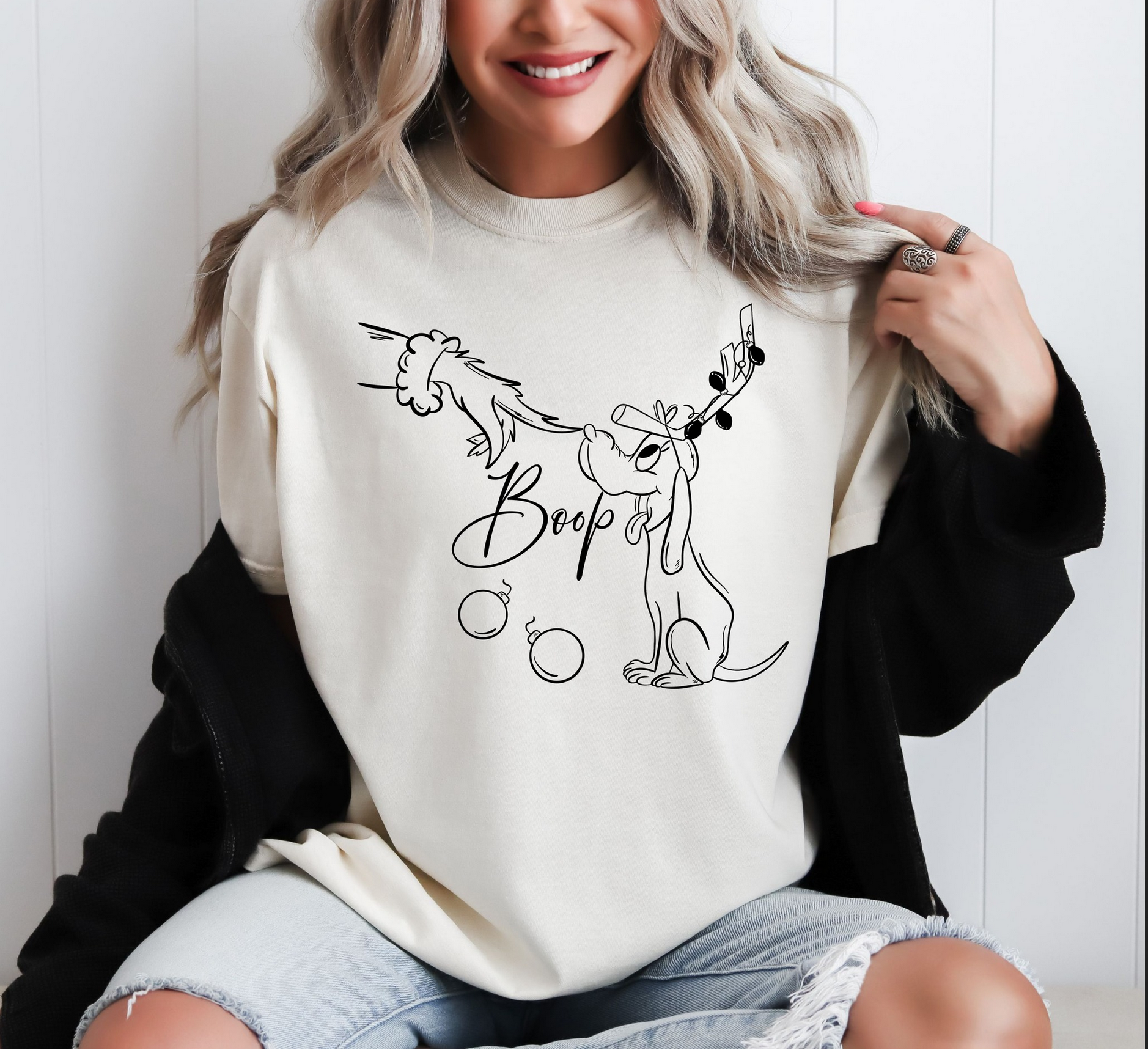 Woman wearing cream Boop! Christmas Dog tee with line art puppy design

Minimalist holiday t-shirt for pet lovers

Neutral graphic tee styled with casual winter outfit

Cute Christmas dog shirt gift for animal lover