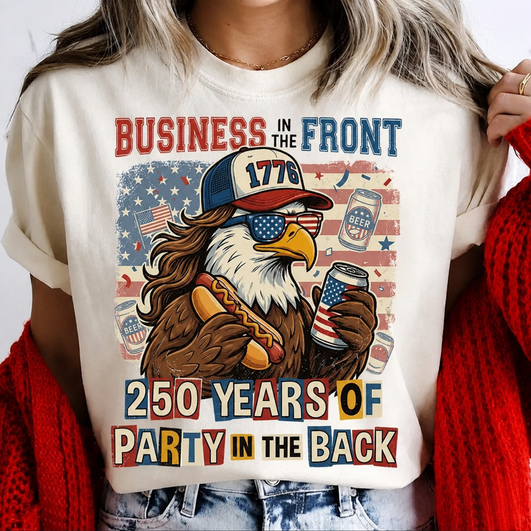 White t-shirt featuring patriotic eagle with 1776 hat holding hotdog and beer with text “Business in the front party in the back”