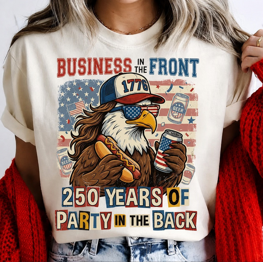 White t-shirt featuring patriotic eagle with 1776 hat holding hotdog and beer with text “Business in the front party in the back”