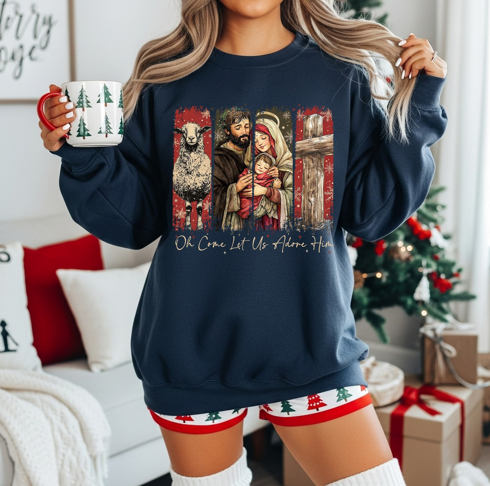 Navy sweatshirt with illustrated Nativity scene showing Mary, Joseph, and Baby Jesus.

Christian Christmas crewneck with rustic Nativity artwork.

Holiday sweatshirt featuring lamb, cross, and Nativity scene.

Woman wearing faith-based Christmas sweatshirt in decorated living room.