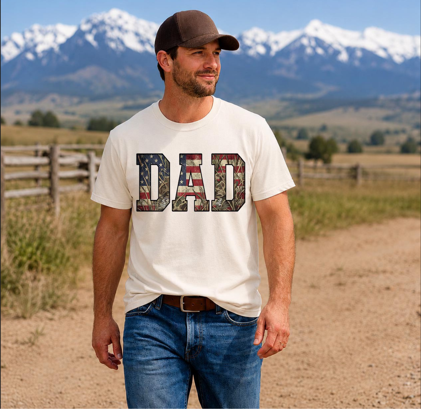 White t-shirt with “DAD” text filled with American flag and camo pattern worn by man outdoors