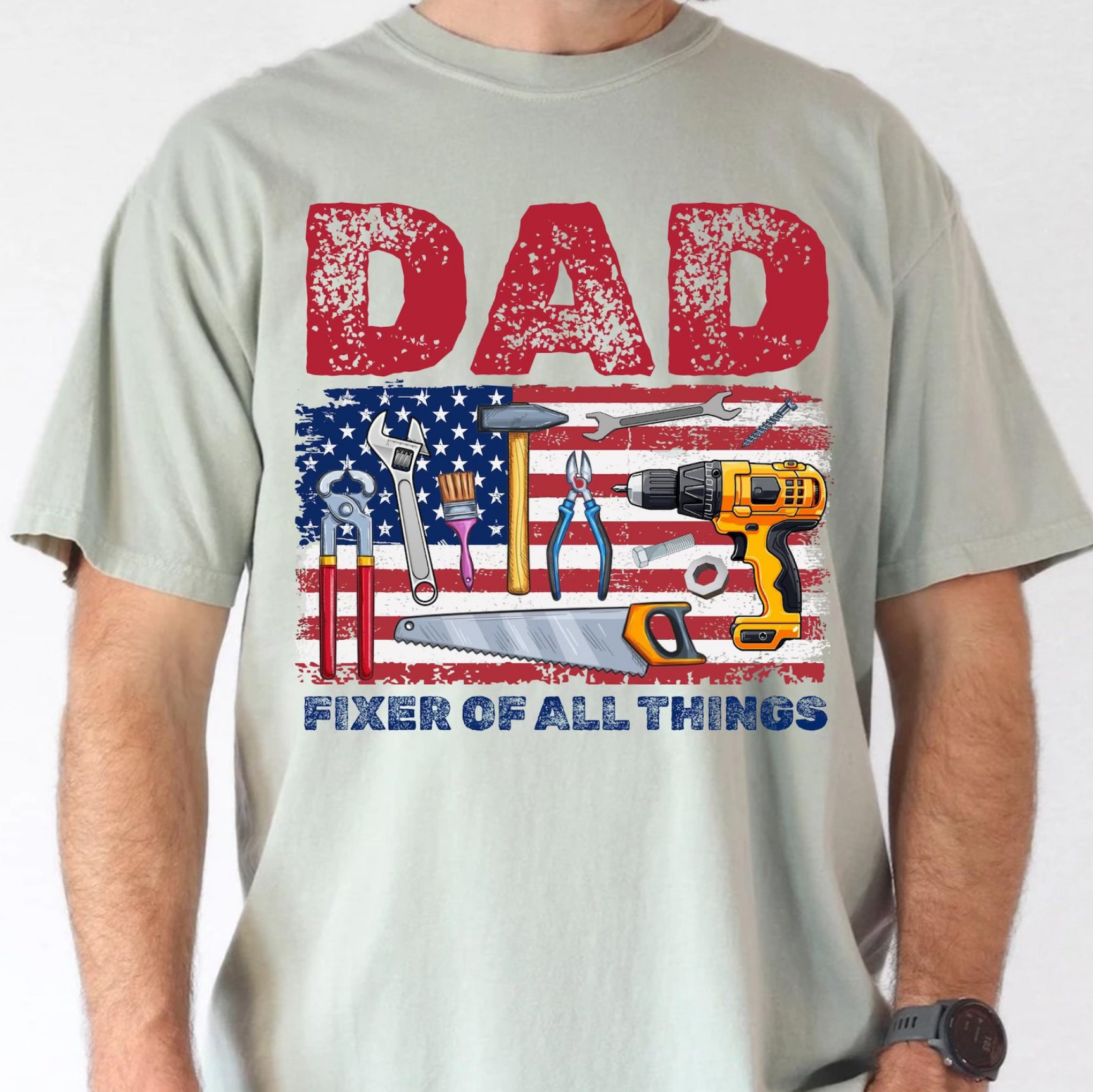 Gray t-shirt with American flag and tools design reading “Dad Fixer of All Things”