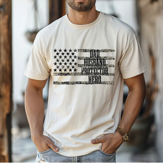Dad Husband Protector Hero graphic tee with distressed American flag on beige shirt
