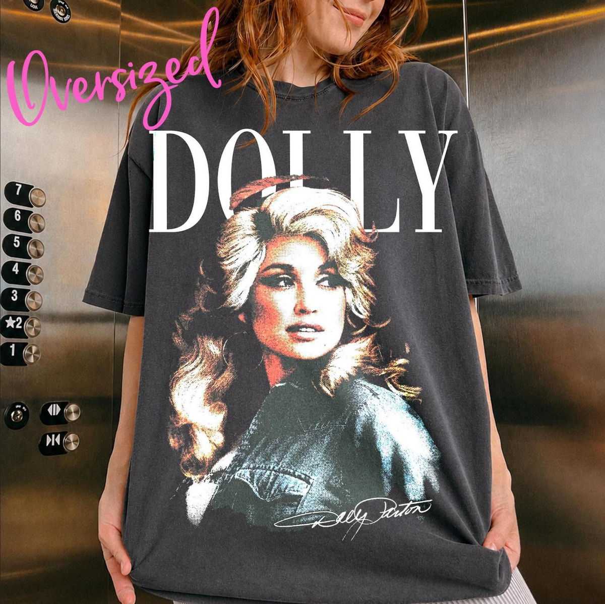 Model wearing an oversized washed-charcoal graphic T-shirt featuring a large colorful vintage-style portrait of Dolly Parton.
