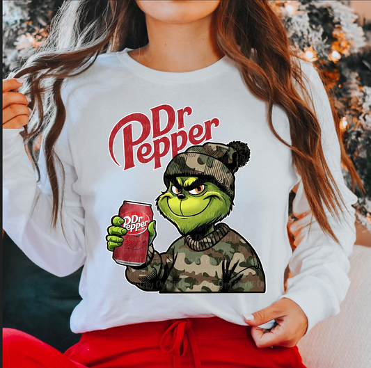 "Grinch Dr Pepper Christmas sweatshirt funny holiday crewneck"

"White Christmas sweatshirt with Grinch in camo holding Dr Pepper"

"Funny holiday soda lover sweatshirt with Grinch graphic"