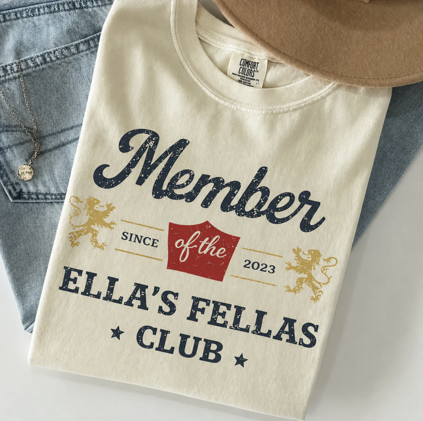 Beige Comfort Colors t-shirt with “Member of the Small Town Wild Fellas Club Since 2023” vintage text design