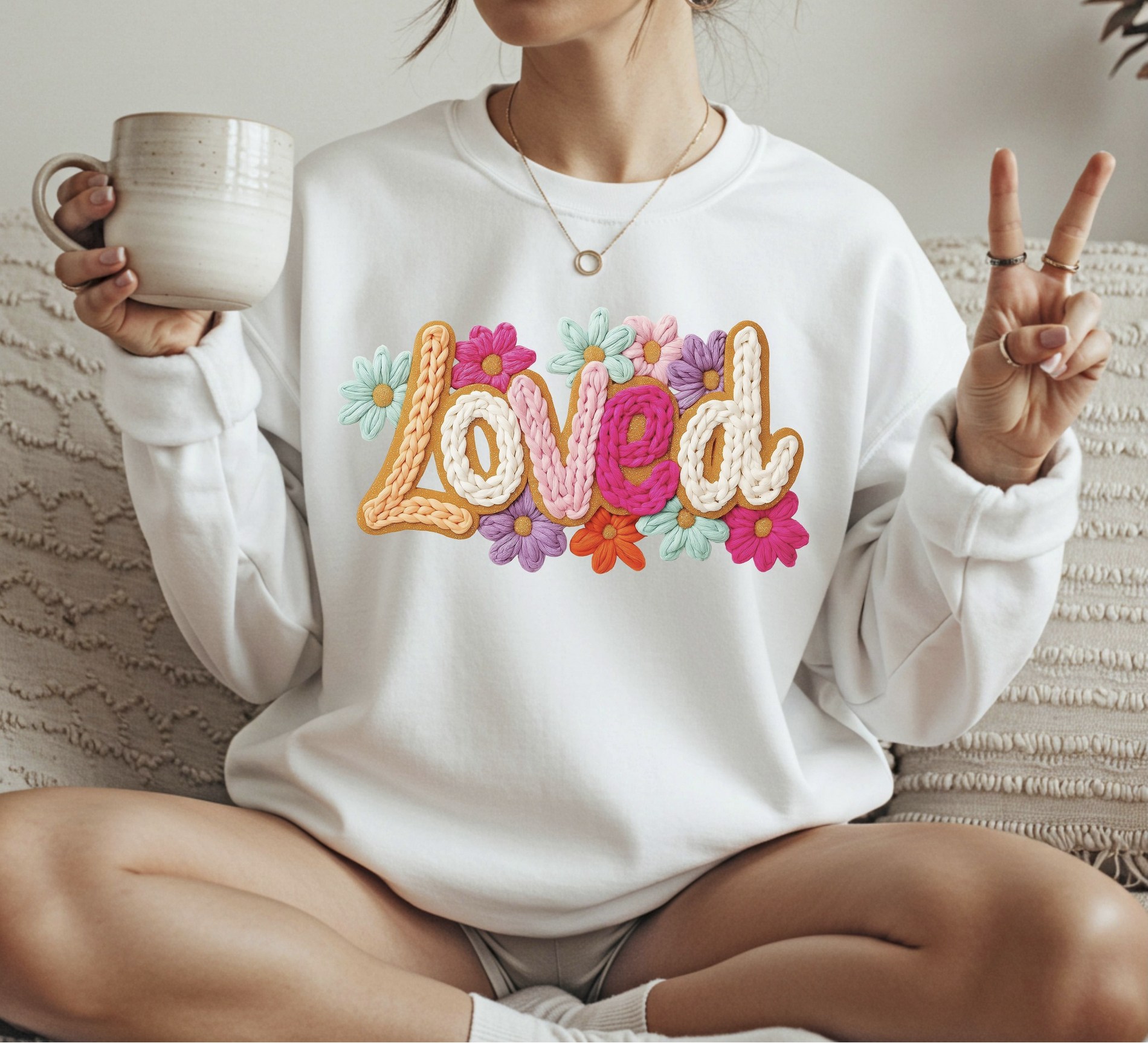 Loved floral sweatshirt with colorful flowers and uplifting lettering
Christian loved sweatshirt styled casually in a cozy setting
Faith inspired sweatshirt with floral design and soft neutral color
