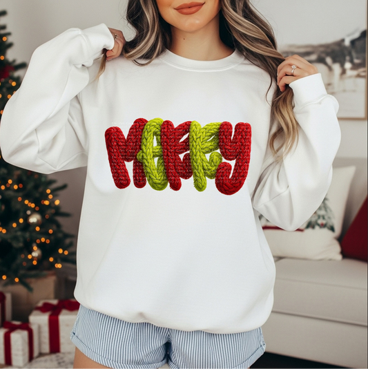 White sweatshirt with red and green rope-textured letters spelling MERRY