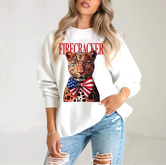 White sweatshirt featuring leopard graphic with red white and blue bowtie and Firecracker text for patriotic boutique fashion