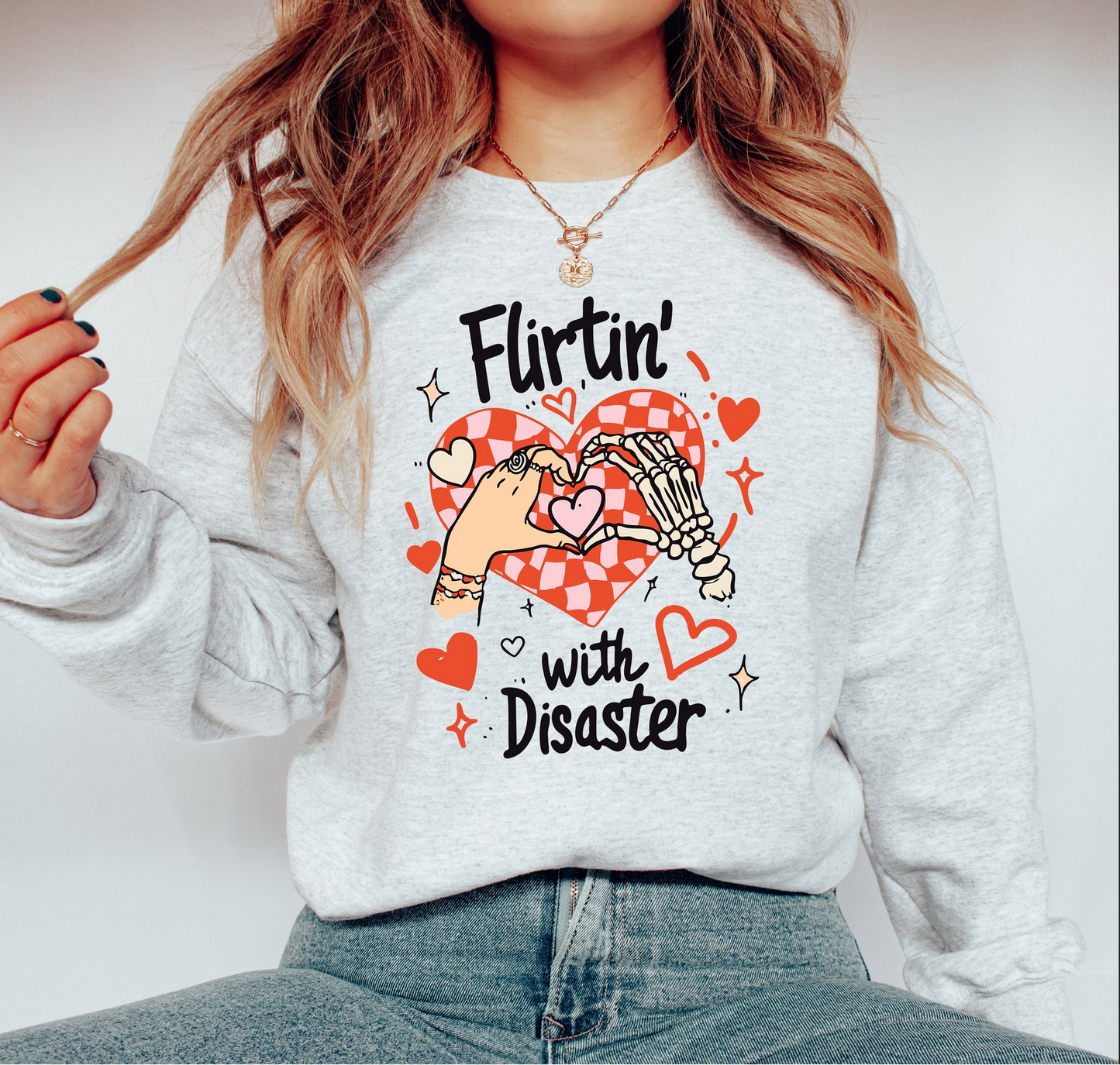 Flirtin with Disaster Valentine sweatshirt with playful heart graphic
Funny Valentine graphic crewneck styled casually
Cute Valentine sweatshirt perfect for Galentine’s Day outfits
