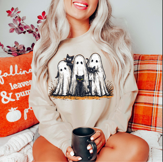 Ghost Cats Halloween sweatshirt – beige crewneck with ghost and black cat graphic

Cute ghost and black cat print sweatshirt – spooky fall outfit idea

Beige Halloween sweatshirt with ghost cats design – cozy autumn look

Fall-themed outfit – Ghost Cats sweatshirt styled with plaid blanket and coffee mug

Ghost Cats crewneck – whimsical spooky season shirt for cat lovers

Halloween ghost cats graphic sweatshirt – black cats peeking from ghost costume