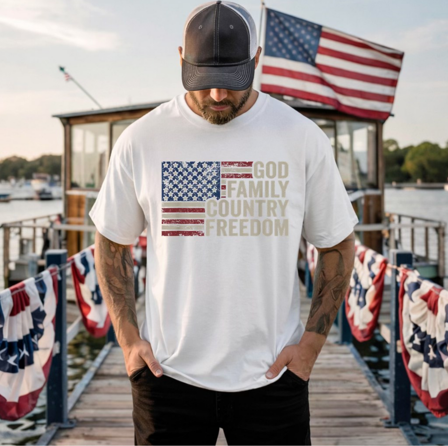 White t-shirt with distressed American flag graphic and text “God Family Country Freedom”