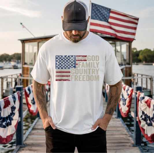 White t-shirt with distressed American flag graphic and text “God Family Country Freedom”