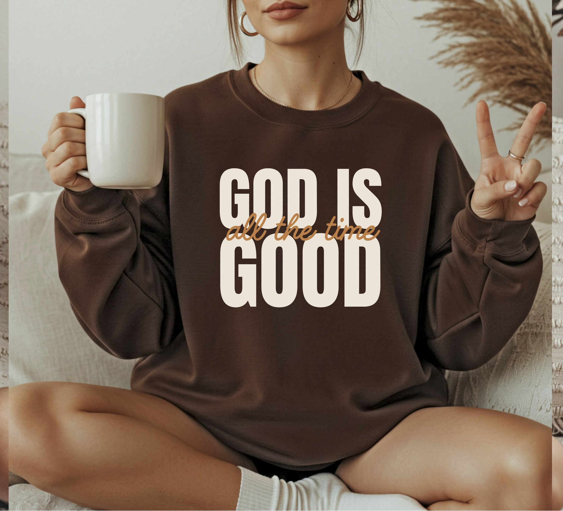 Brown God Is Good graphic sweatshirt with bold faith-inspired lettering