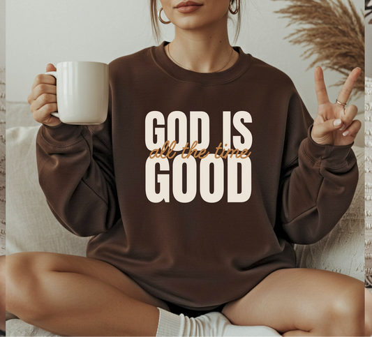Brown God Is Good graphic sweatshirt with bold faith-inspired lettering