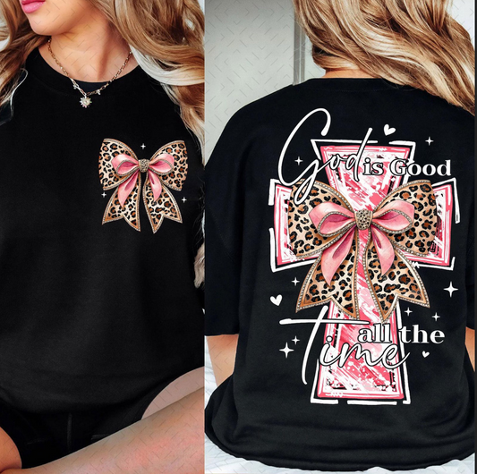 God Is Good All the Time graphic tee with leopard bow cross design on black shirt
