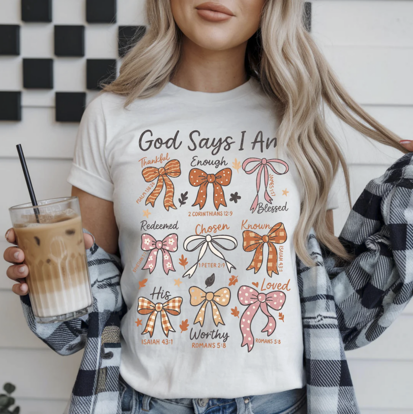 "God Says I Am Christian Bible verse graphic t-shirt with bows"

"Inspirational scripture affirmation tee for women"

"Christian unisex shirt with positive faith message"