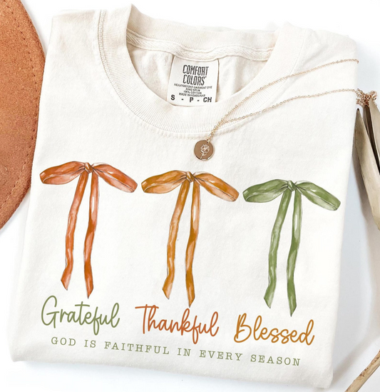 Comfort Colors cream tshirt with three autumn bows and text Grateful Thankful Blessed – God is faithful in every season"