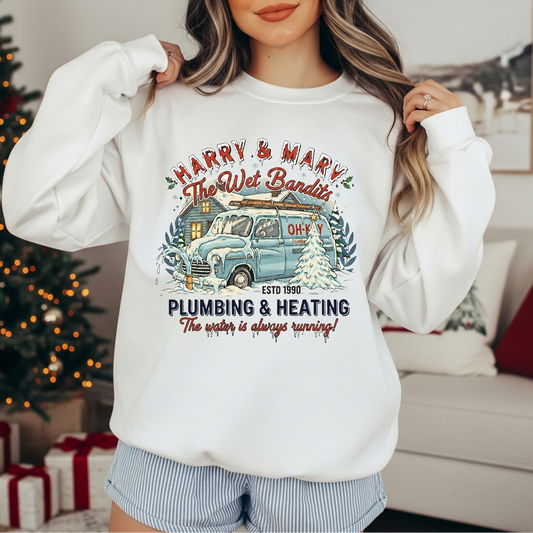 Woman wearing Holiday Plumbing Co. sweatshirt in white with vintage truck design

Funny retro holiday sweatshirt with snowy plumbing theme

Cozy Christmas crewneck with vintage lettering and truck graphic

White unisex sweatshirt styled for holiday comfort