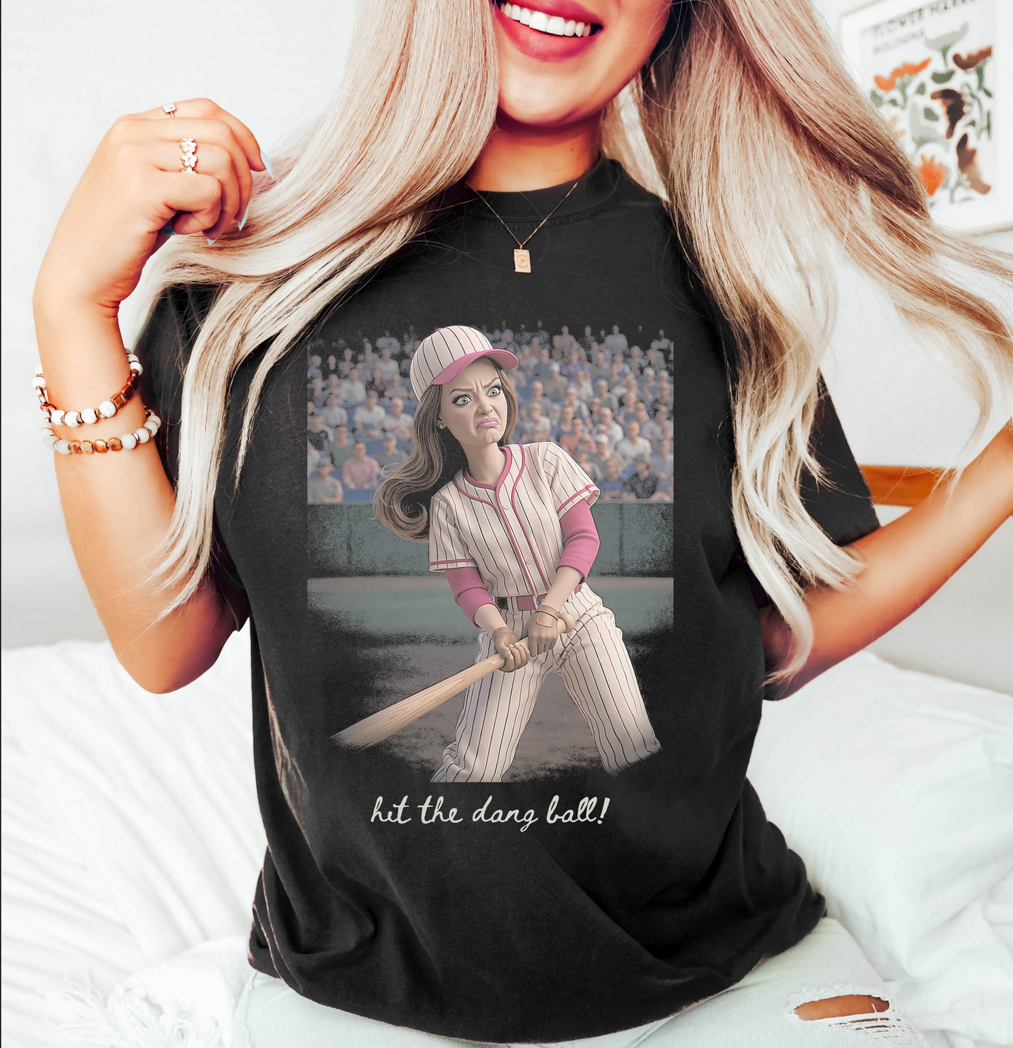 Black graphic t-shirt featuring a funny baseball batter illustration with the phrase Hit The Dang Ball for softball moms and baseball game day outfits