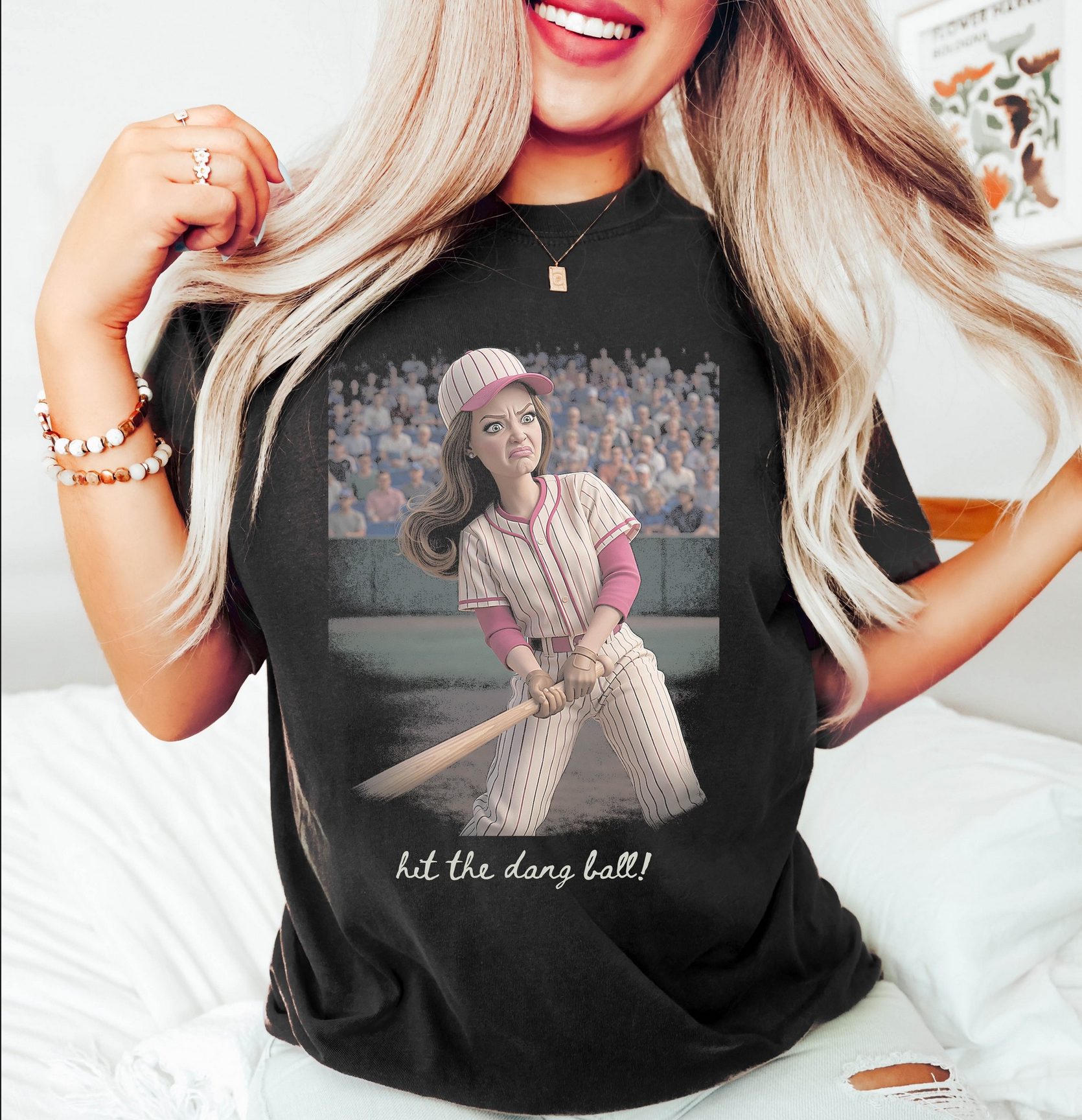 Black graphic t-shirt featuring a funny baseball batter illustration with the phrase Hit The Dang Ball for softball moms and baseball game day outfits