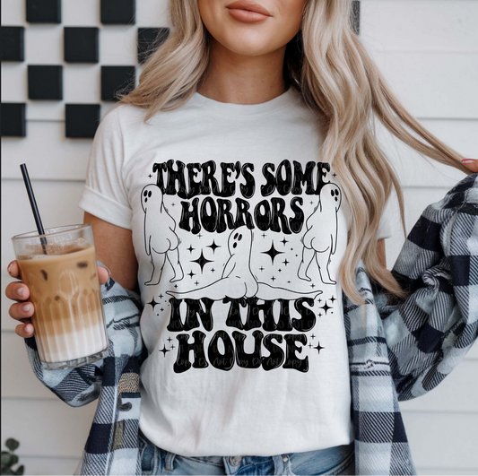 There's Some Horrors in This House ghost graphic tee with retro lettering on white shirt
