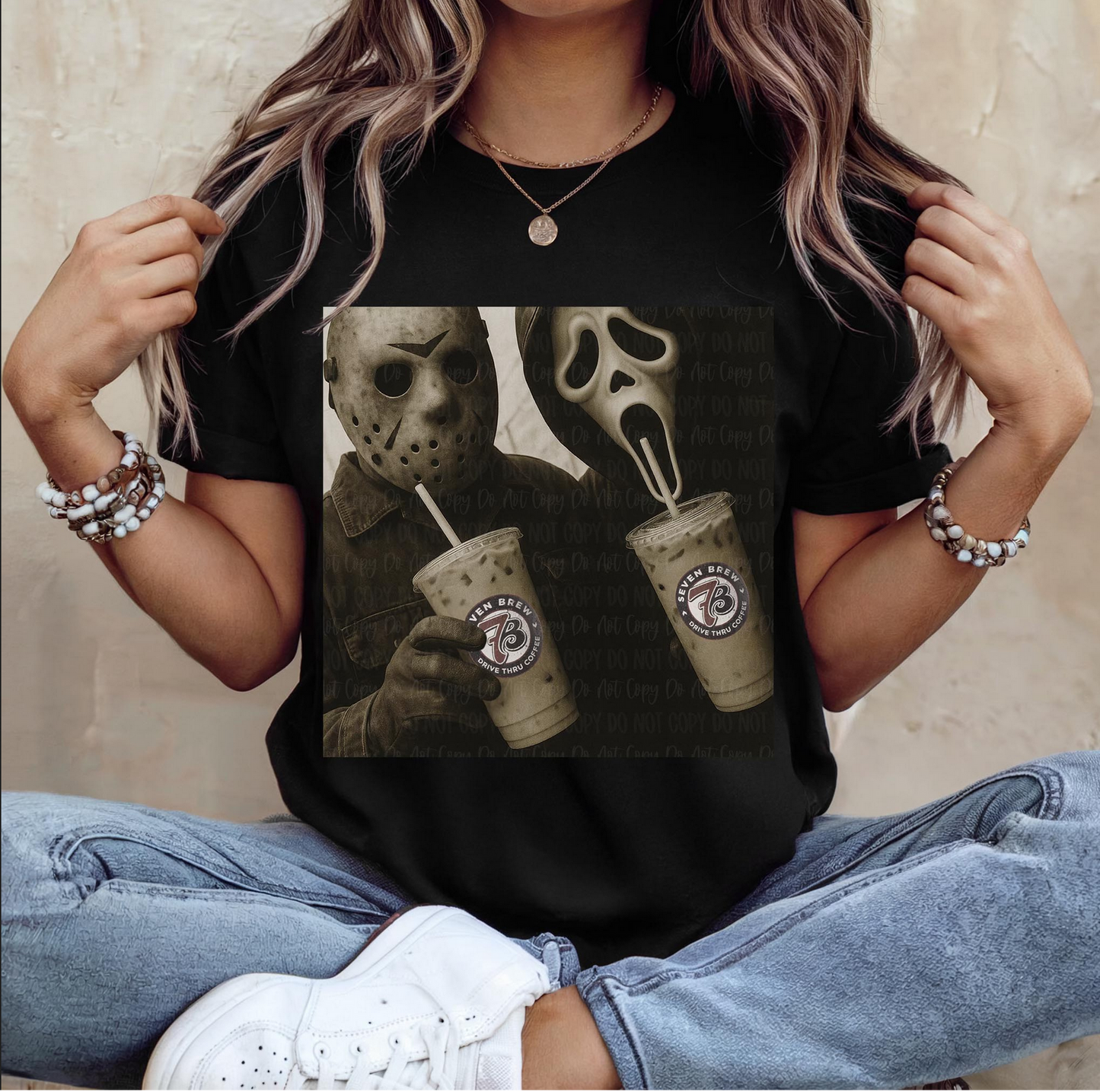 Woman wearing black graphic tee with Jason Voorhees and Ghostface drinking iced coffee – vintage horror Halloween t-shirt