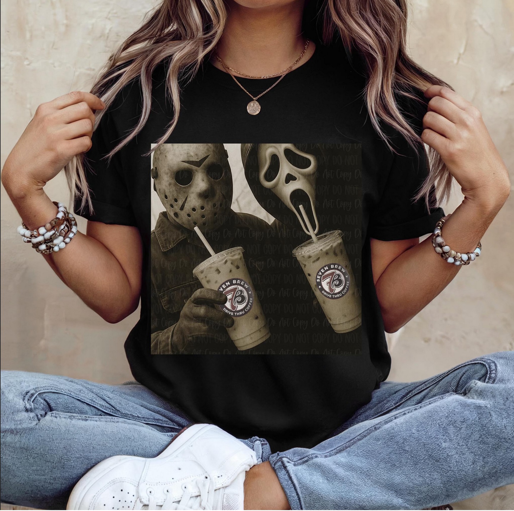 Woman wearing black graphic tee with Jason Voorhees and Ghostface drinking iced coffee – vintage horror Halloween t-shirt