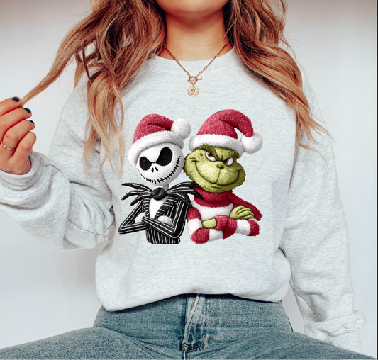 Grey sweatshirt with two festive cartoon characters wearing Santa hats, drawn in a quirky holiday style.