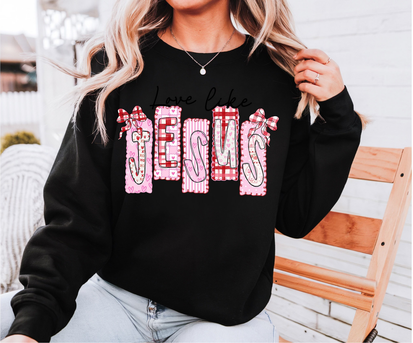 Black Love Like Jesus graphic sweatshirt featuring pink bow and heart patch-style lettering