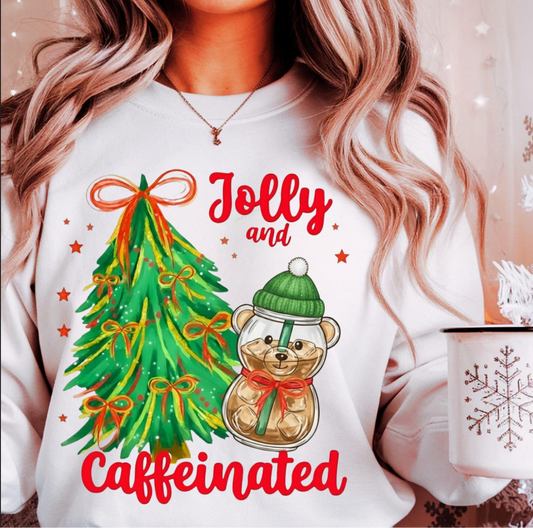 Woman wearing Jolly and Caffeinated sweatshirt holding snowflake mug

White Christmas sweatshirt with coffee bear and festive tree design

Cozy holiday crewneck perfect for coffee lovers

Funny Christmas pullover with red and green festive print