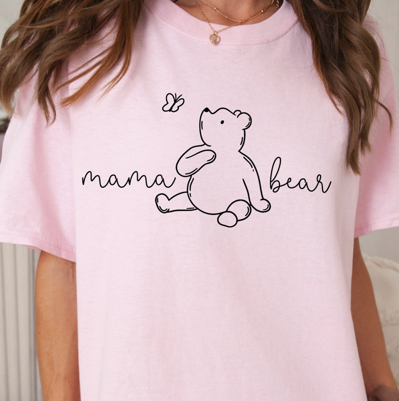 Light pink graphic tee with “mama bear” text and bear illustration – $15 mom t-shirt