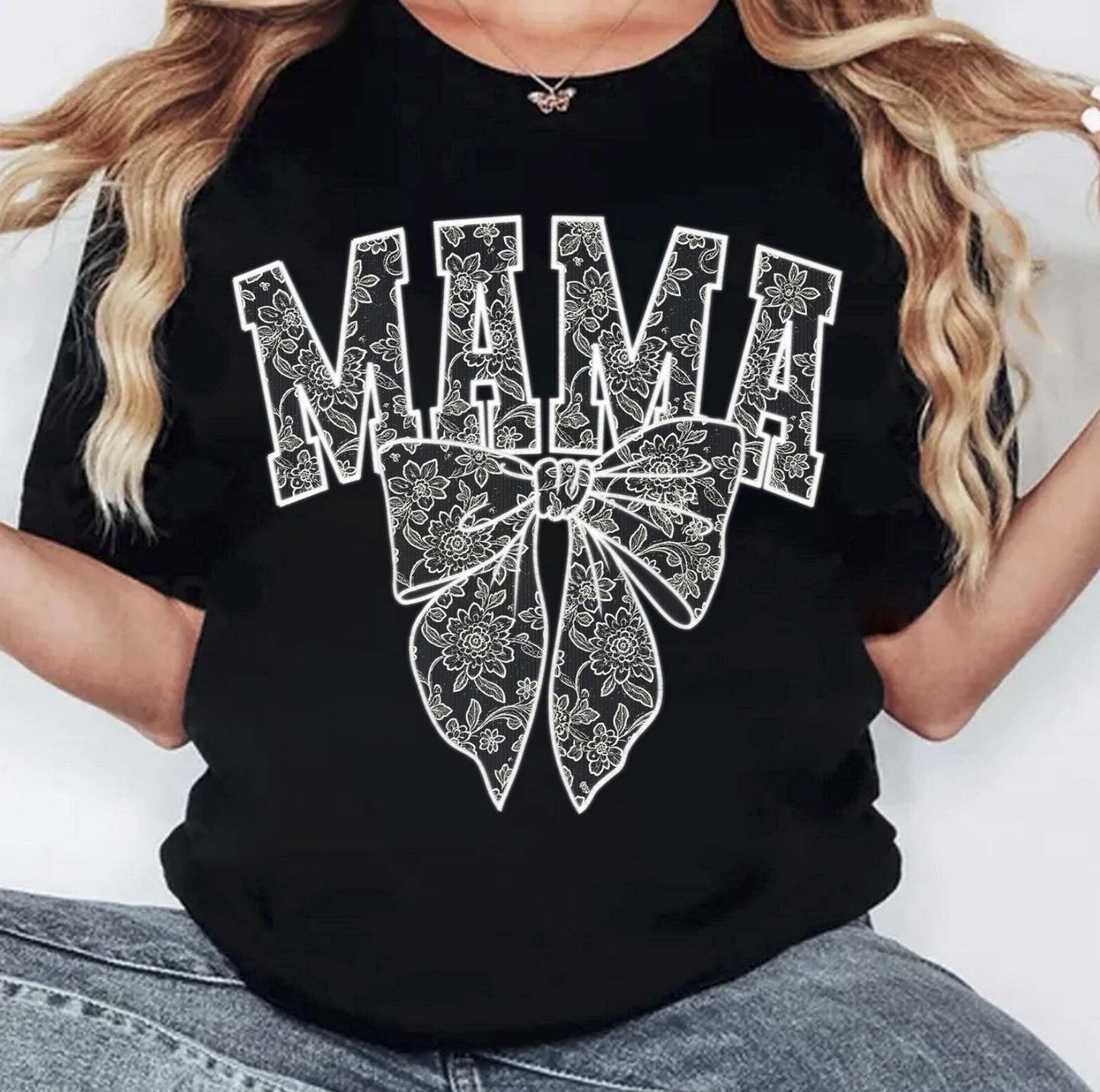 Black graphic tee with floral bow and bold “MAMA” text – $15 mom life t-shirt