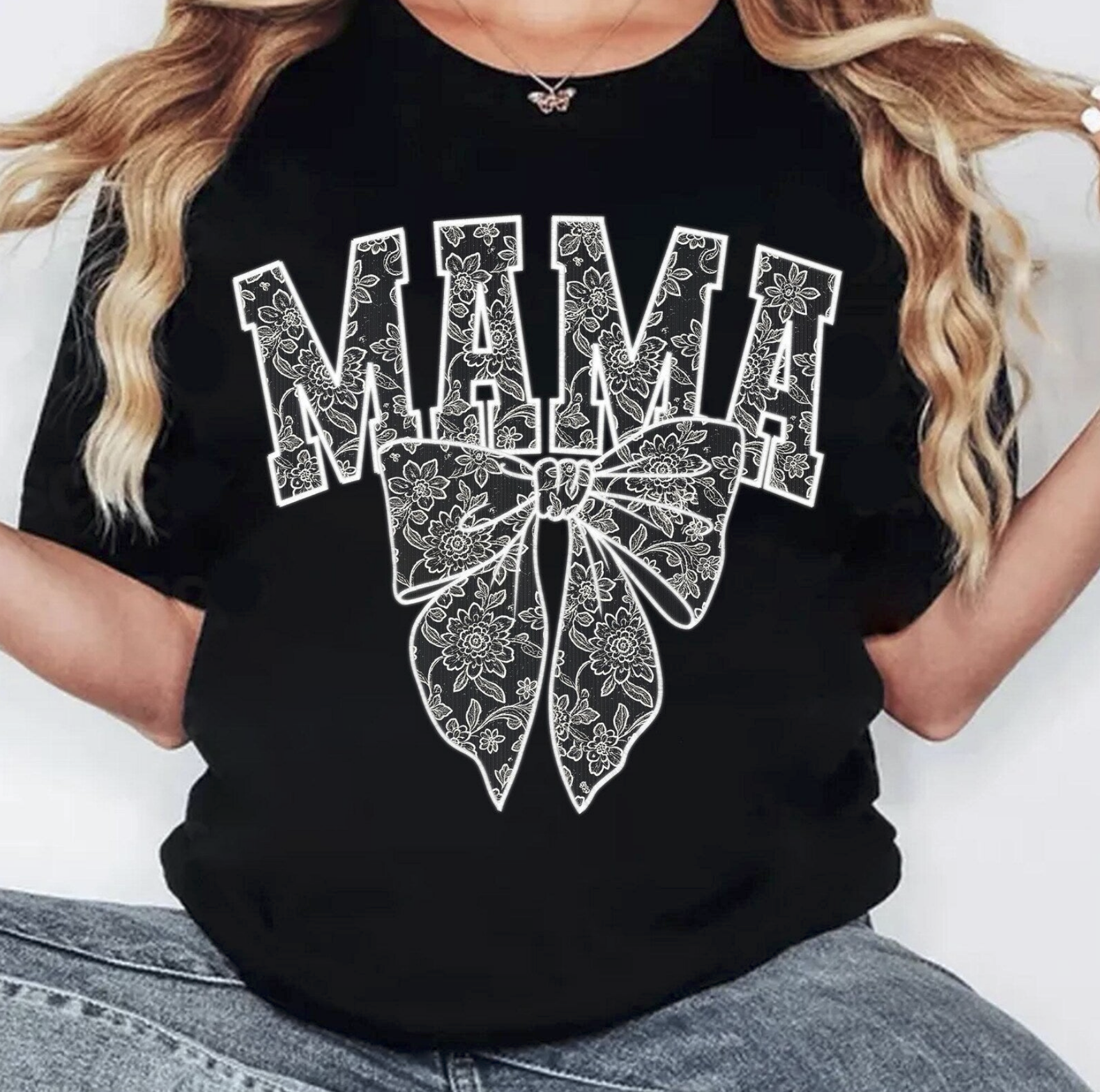 Black graphic tee with floral bow and bold “MAMA” text – $15 mom life t-shirt