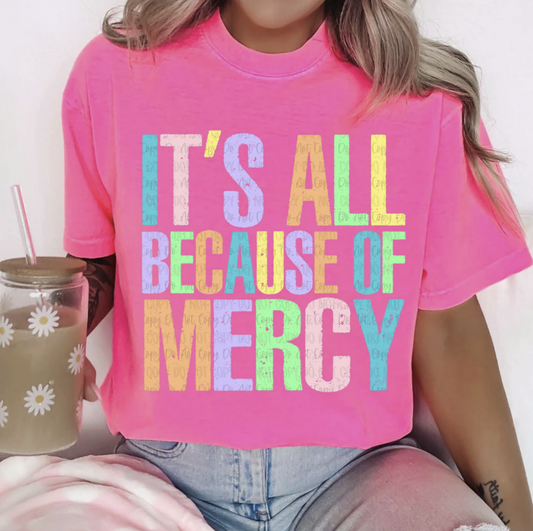It’s All Because of Mercy Christian T-Shirt – bright pastel faith graphic tee on pink shirt