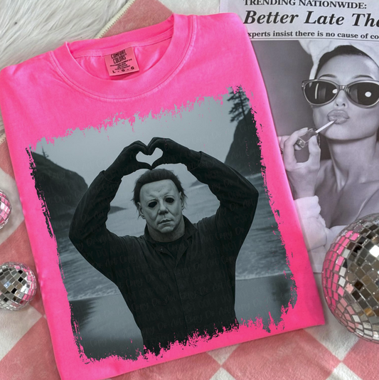 Michael Myers Pink Heart Hands T-Shirt – funny horror graphic tee with slasher in black-and-white design on pink shirt