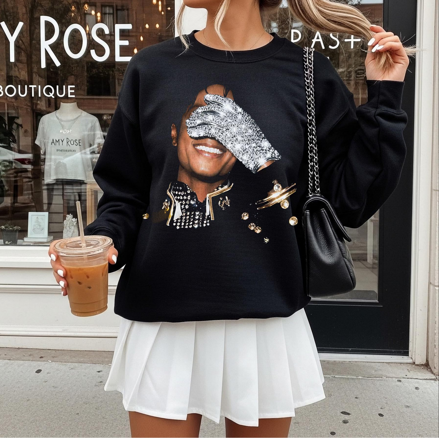 Black graphic sweatshirt featuring iconic pop legend inspired portrait with glitter glove design for trendy boutique fashion
