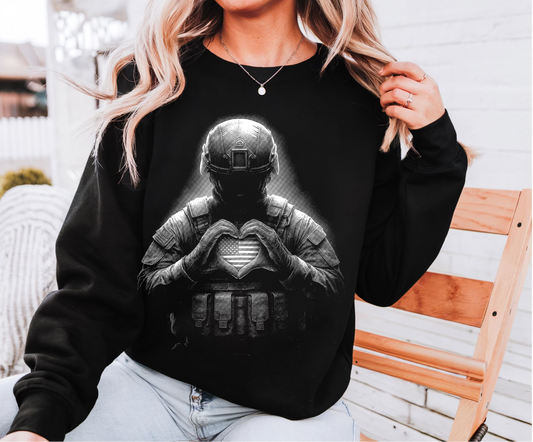 Black graphic sweatshirt featuring armored soldier forming a heart symbol with hands