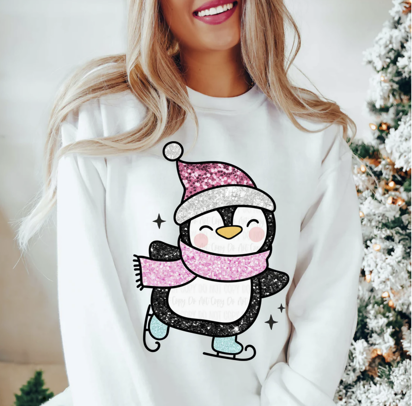 Woman wearing white sweatshirt with sparkly penguin ice-skating design

Cute winter penguin sweatshirt with pink hat and scarf

Cozy holiday crewneck perfect for Christmas or winter season

Festive white pullover with adorable skating penguin art