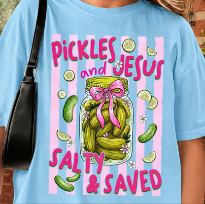 Blue t-shirt featuring mason jar of pickles with bow and text “Pickles and Jesus Salty and Saved”