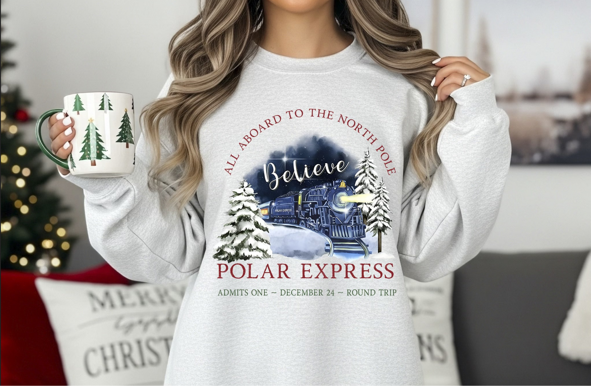 Woman wearing gray Christmas Express sweatshirt holding mug

Holiday train sweatshirt with “Believe in the Magic” design

Cozy winter crewneck styled with Christmas decor

Unisex gray sweatshirt — festive Christmas outfit idea