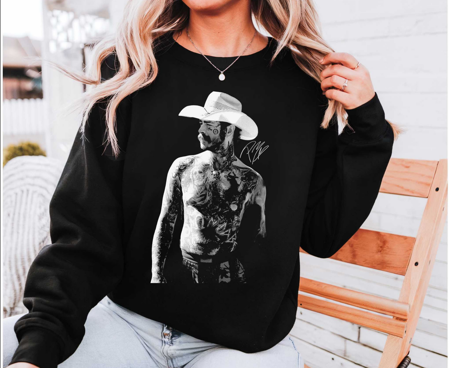 Black western cowboy graphic sweatshirt with country music inspired artwork
