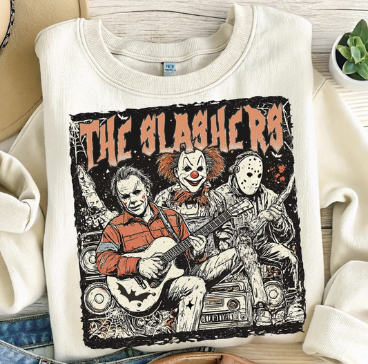 "The Slashers sweatshirt with horror villains band graphic"

"Halloween sweatshirt featuring Michael Myers Jason Voorhees Pennywise"

"Vintage horror movie villains crewneck sweater"