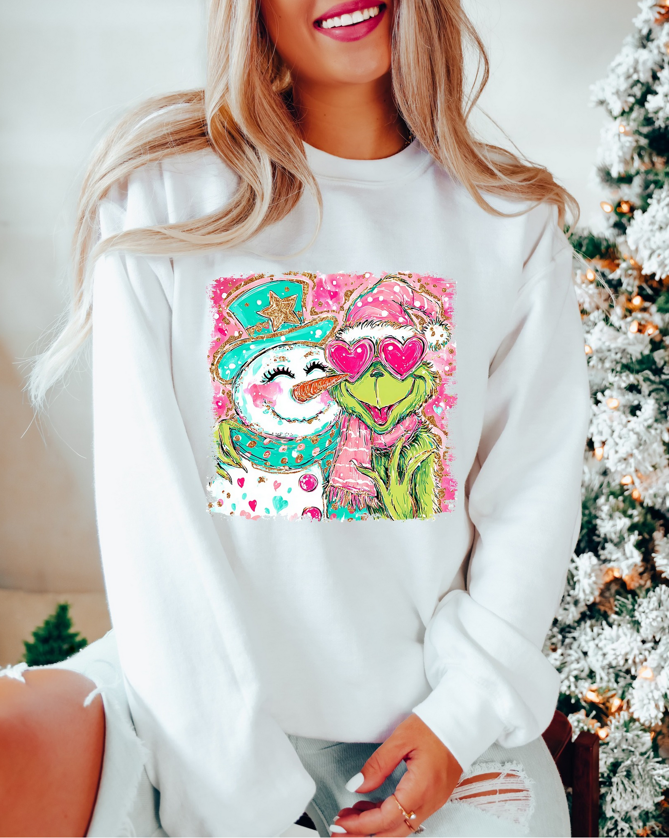 Woman wearing white Christmas Love sweatshirt with pink and green festive couple design

Cozy holiday sweatshirt featuring cute winter couple graphic

White unisex Christmas pullover with sparkly heart and snow design

Festive holiday sweatshirt styled for cozy winter look
