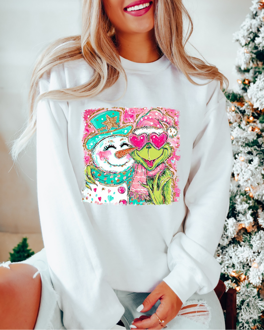 Woman wearing white Christmas Love sweatshirt with pink and green festive couple design

Cozy holiday sweatshirt featuring cute winter couple graphic

White unisex Christmas pullover with sparkly heart and snow design

Festive holiday sweatshirt styled for cozy winter look