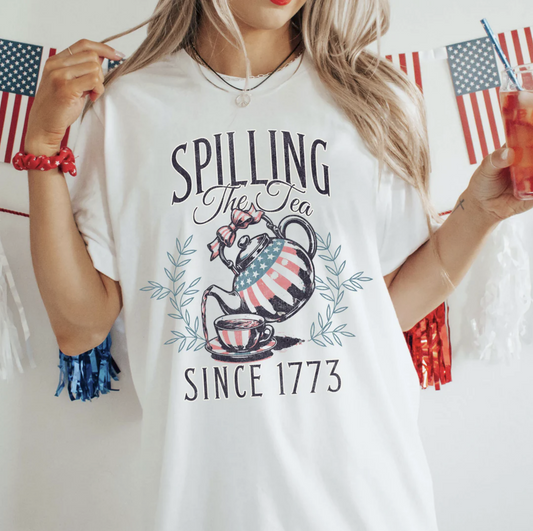 Spilling the Tea Since 1773 graphic tee with patriotic teapot and cup design on white shirt
